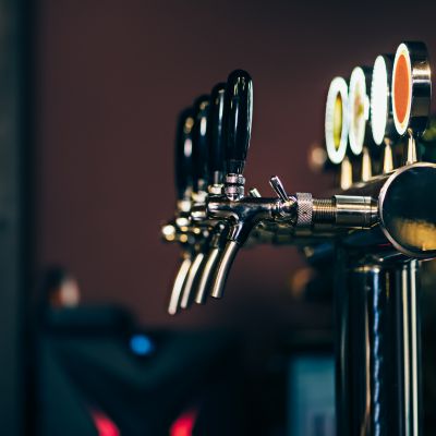 Modern Many beer taps in the beer bar.