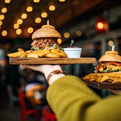 Woman carrying burger