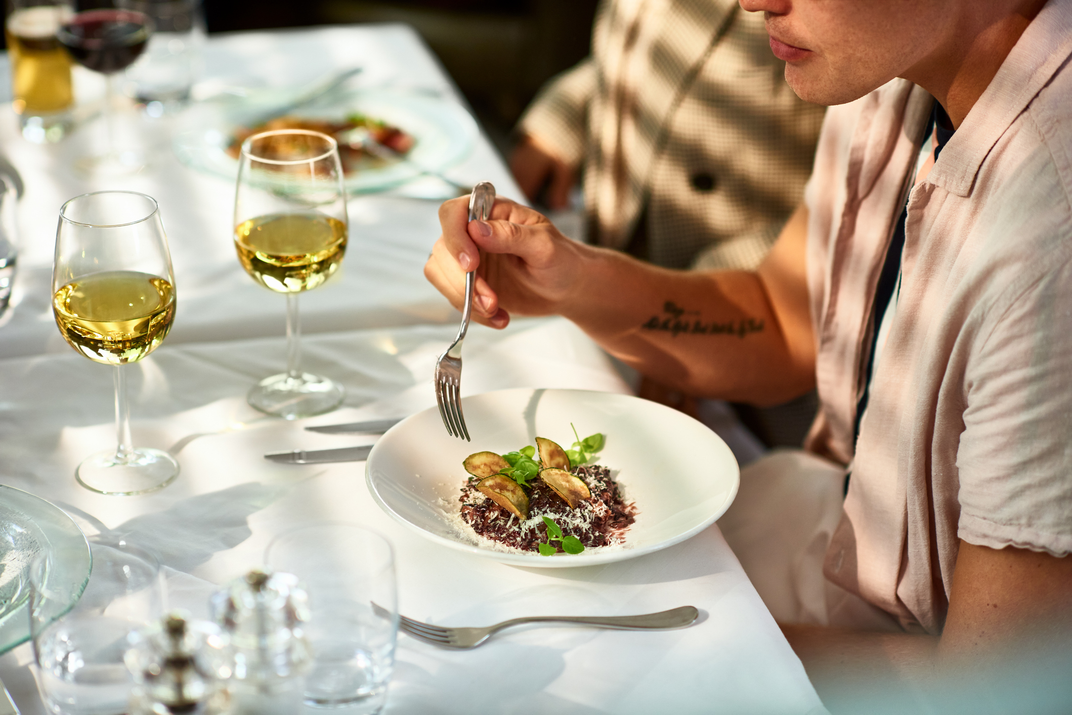 Man eating gourmet food in restaurant
